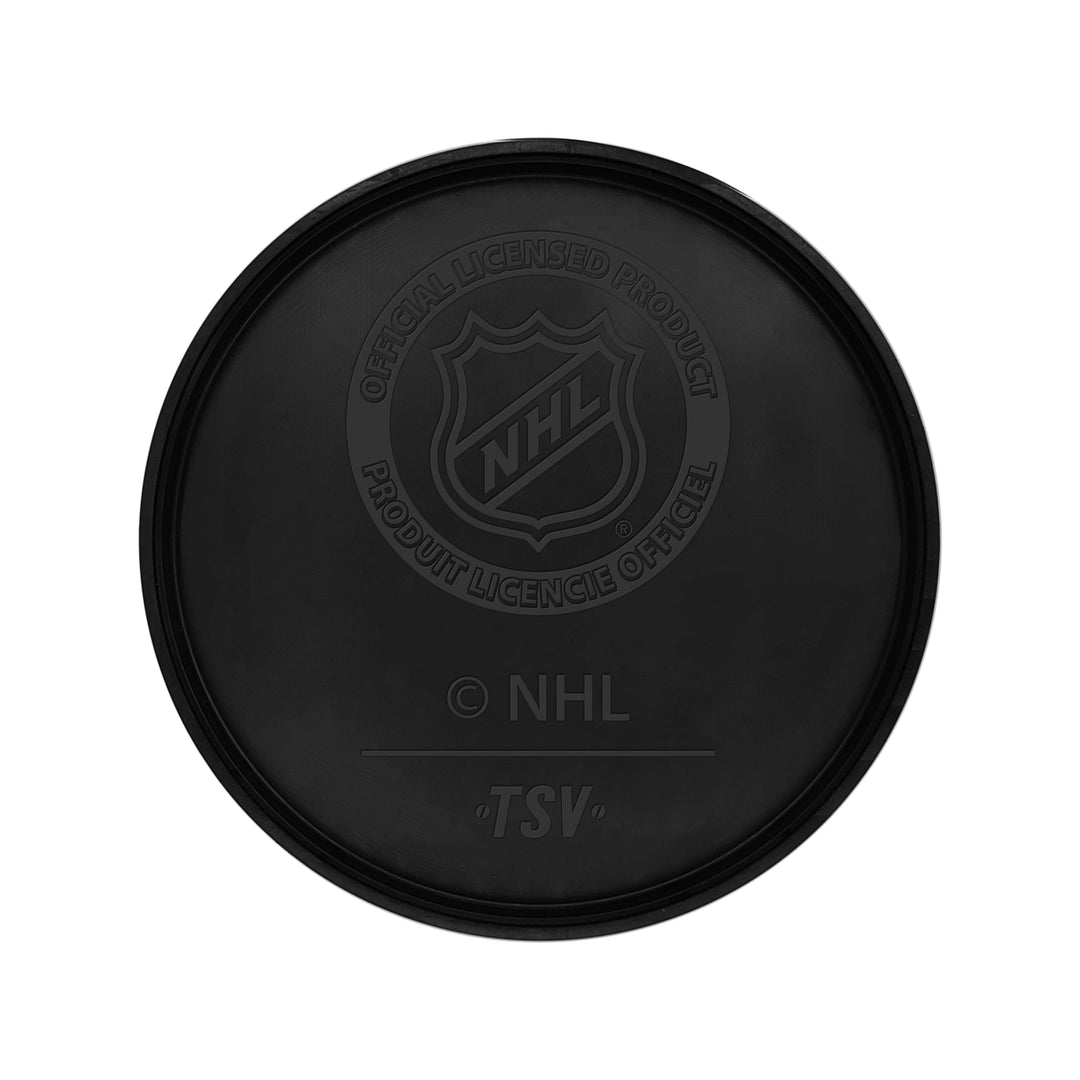 Black hockey puck with NHL logo, part of Vegas Golden Knights merchandise