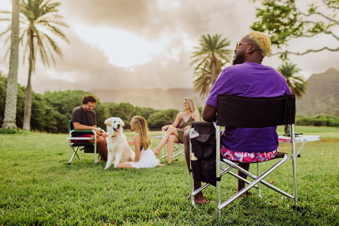 Group of people and a dog relaxing outdoors on grass with Vegas Golden Knights Sports Chair