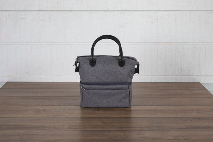 Gray canvas Urban Lunch Bag cooler with black handles on wooden surface